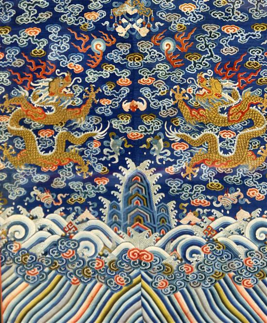 A near pair of Chinese blue silk kesi dragon panels, c.1860, 73cm x 67cm and 81cm x 67cm, some repairs